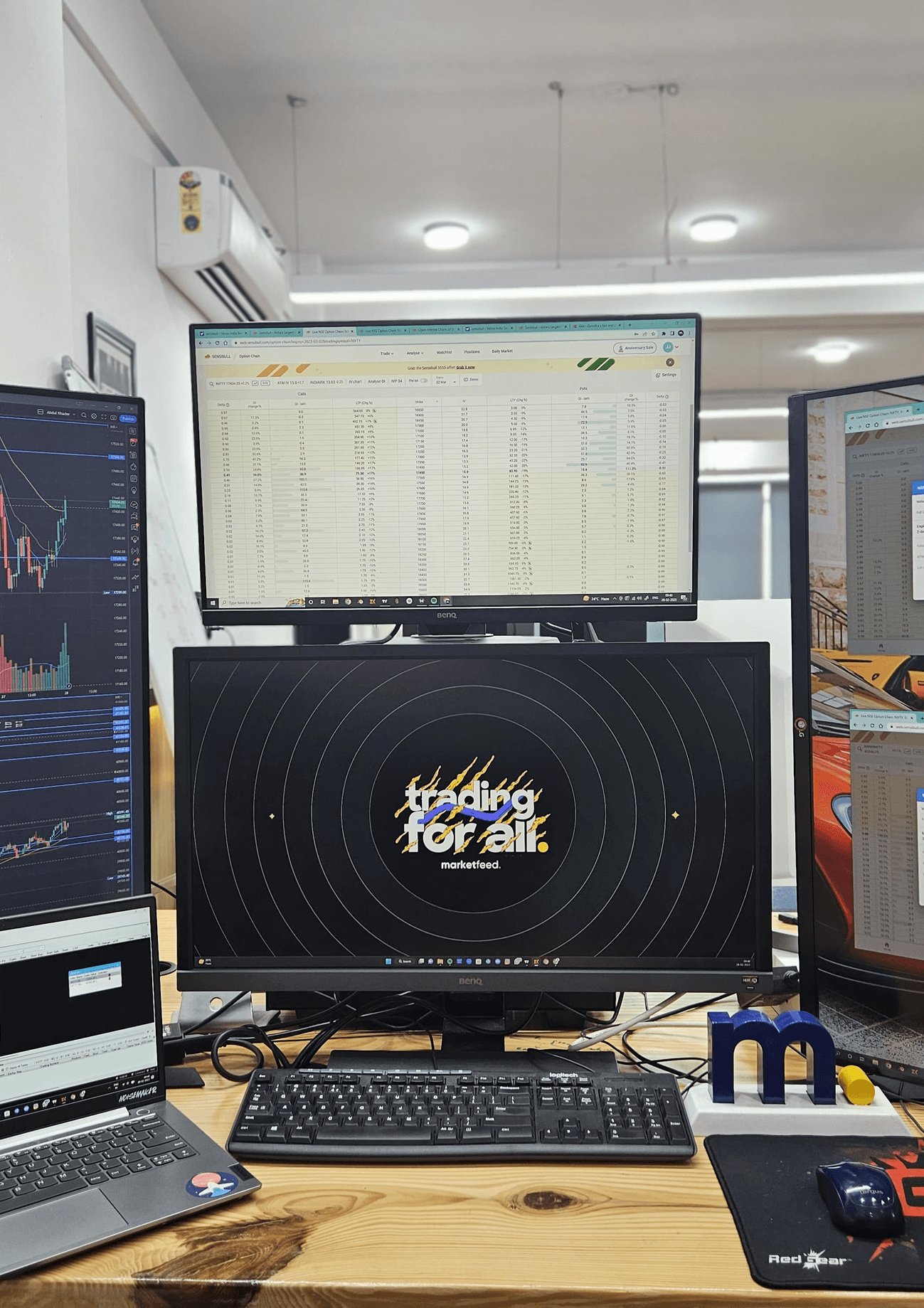 Team members working on laptop